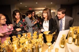 Guests looking at bottles of wine
