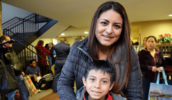 Woman standing with child