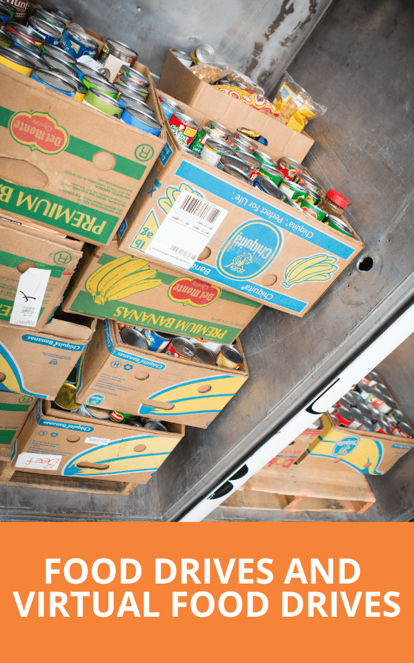 Boxes of food stacked up in the back of a truck
