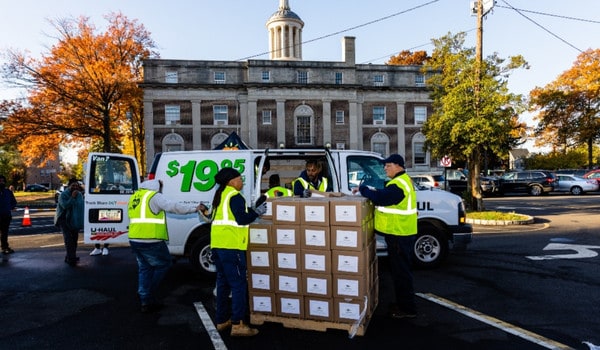 CFBNJ employees loading boxes into a van