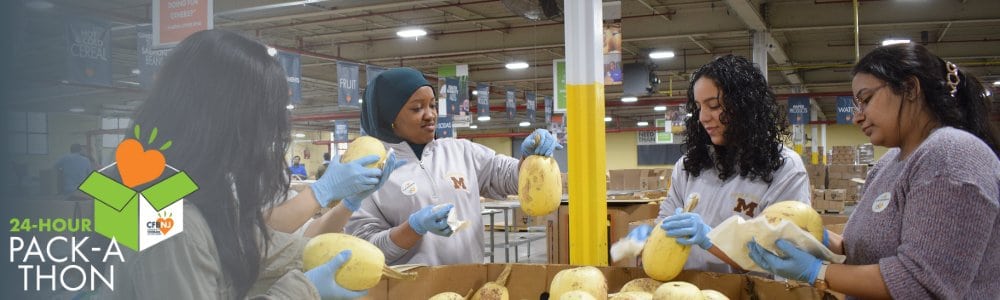 Volunteers packing fruit in the CFBNJ warehouse